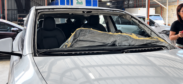 Tesla Model Y damaged windshield before replacement